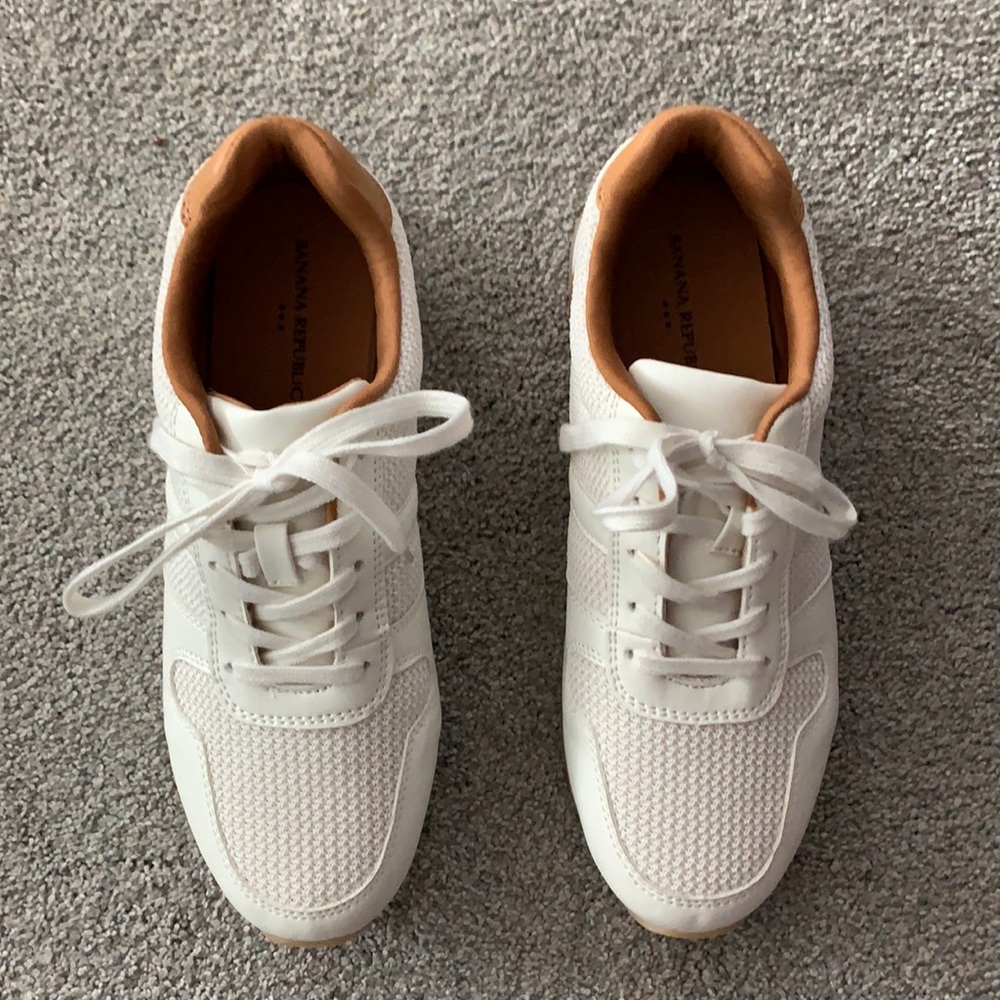 Women’s white and tan sneakers